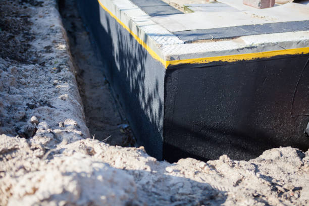 Professional Waterproofing technician working in Mayville, NY